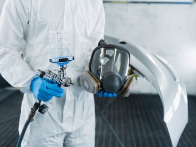 lose-up-view-of-car-painter-with-paint-gun-and-protective-respirator-in-hands-.jpg lose-up-view-of-car-painter-with-paint-gun-and-protective-respirator-in-hands-.jpg